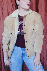 Women's or men's vintage 1950's Alaska Sleeping Bag Co., Portland, Oregon label long sleeve tan colored suede jacket with popper buttons and cream shearling liner.