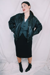 Women's vintage 1980's long sleeve black leather lightweight jacket. Dolman fit and snap buttons.