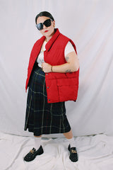 Men's or women's vintage 1980's Woolrich, Made in USA label sleeveless cherry red puffer vest. Popper buttons up the front and two pockets.