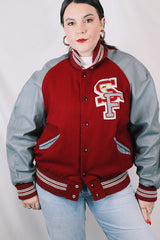 Men's or women's vintage 1980's DeLong, Made in USA label long sleeve dark red and grey varsity letterman jacket with patches and pins. Wool and leather material.