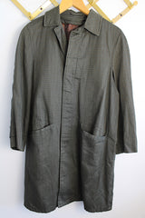 Men's or women's vintage 1960's Brent Prep Sold Exclusively by Montgomery Ward long sleeve long length cotton material lightweight trench coat in a dark green and all over subtle plaid print.