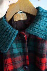 Women's vintage 1960's Pendleton label long sleeve plaid print wool cropped lightweight jacket in red and green colors. Fully lined, buttons up the front, and two front pockets.