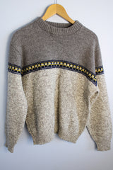 Women's or men's vintage 1990's Lobo by Pendleton label long sleeve pullover wool sweater in dark and light grey colors with navy and yellow print pattern across chest.