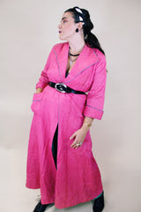 Women's vintage 1950's Lyn Delle label long sleeve long length bright pink quilted robe jacket with teal colored trim.