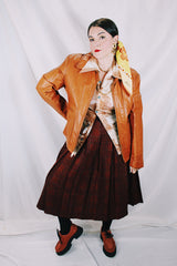 Men's or women's vintage 1970's The Leather Shop, Sears The Men's Store label long sleeve short length camel brown colored leather zip up jacket.