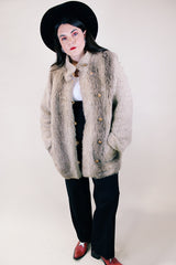 Women's vintage 1980's Lifestyle 80's by Andrea Ungar label long sleeve jacket with faux fur body in front and back and acrylic arms. Buttons up the front with side pockets.