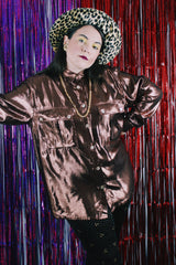 Women's vintage 1980's Made in USA long sleeve button up blouse with two chest pockets and pearly buttons.