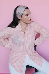 Men's or women's vintage 1970's Montgomery Ward label long sleeve cotton and polyester material pink striped button up shirt with clear buttons.