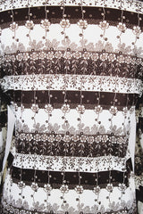 Women's vintage 1970's long sleeve button up blouse with dagger collar in white and chocolate brown colors with all over ditsy floral print.