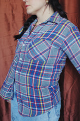 Men's or women's vintage 1970's Big Mac label long sleeve plaid button up flannel shirt in blue, grey, red, and yellow with white buttons.