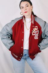Men's or women's vintage 1980's DeLong, Made in USA label long sleeve dark red and grey varsity letterman jacket with patches and pins. Wool and leather material.