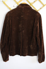 Men's or women's vintage 1970's long sleeve short length chocolate brown jacket in a fuzzy soft suede material. Gold hardware, zipper up the front, contrast stitching, and dagger collar.