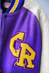Women's or men's vintage 1960's Shields, Sporting Goods Inc., Vancouver, Washington label long sleeve wool and leather varsity letterman jacket in purple, cream, and yellow colors.