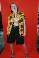 Women's vintage 1970's La Rosa, San Francisco label short sleeve button up blouse in yellow with all over brown Hawaiian print.