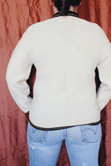 Women's vintage 1960's Brentwood Sportswear label long sleeve zip up cardigan in a waffle knit cream color. Has black and tan trim throughout.