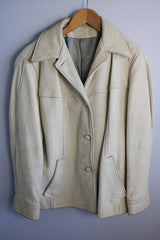 Women's vintage 1960's Custom Made Genuine Native Deerskin label long sleeve cream colored leather jacket. Fully lined, side pockets, and leather covered buttons.