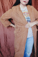 Women's vintage 1970's Joseph Magnin label long length long sleeve camel brown tan colored suede open front jacket.
