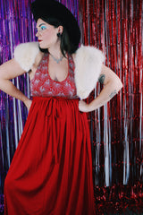 Women's vintage 1980's maxi length sleeveless red polyester halter wrap dress. Has silver sequins and beads on front chest.