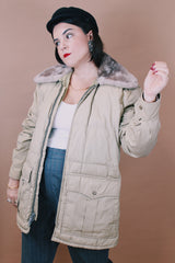 Women's or men's vintage 1980's Tempco Down Insulated, By Tempo Quilters, Seattle, Made in the USA label size large tan colored zip up puffer jacket with grey faux fur trim collar.