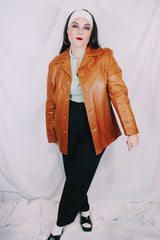 Men's or women's vintage 1970's Grodins label long sleeve tan light brown buttery leather jacket with button closure. Western style.