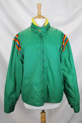 Women's or men's vintage 1980's Pacific Trail Sportswear label long sleeve green zip up nylon puffer jacket with yellow and rainbow colored trim.