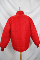 Women's or men's vintage 1980's Tonkin Wearables, Woodinville, WA, Made in USA label long sleeve bright red nylon puffer jacker with patch on left chest and a zipper and popper buttons closure.