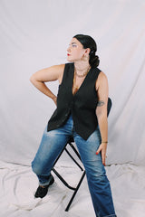 Men's or women's vintage 1970's sleeveless chocolate brown waistcoat vest in a wool and rayon mix material. Tortoise buttons and front pockets.
