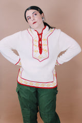 Women's vintage 1970's New Improved Kimlon by RBK Importers label size medium long sleeve white acrylic pullover sweater with half closure and red and yellow trim.