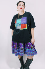 Women's or men's vintage 1996 Made in El Salvador label short sleeve black Steely Dan tour tee with multicolored graphic on front and back.