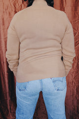 Women's or men's vintage 1970's Challenger, Made in USA label long sleeve camel brown colored zip up cardigan with a collar. Knit with suede trim on the front.