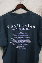 Women's or men's vintage 1997 Gildan Heavyweight, Made in Canada label short sleeve black The Kinks' Ray Davies The Storyteller tour tee with colored graphic and text on front and back.