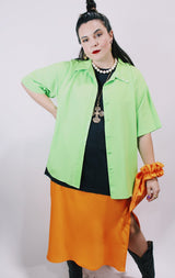 Women's vintage 1980's Collection by Shirq, New York, Made in USA label short sleeve bright lime green button up blouse with collar and shiny trim in a lightweight poly material.