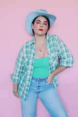 Men's or women's vintage 1970's JCPenney label long sleeve button up shirt in a white, green, and blue plaid print. Clear buttons, two chest pockets.