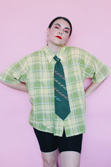 Men's or women's vintage 1960's Cortland short sleeve button up collared shirt with two chest pockets in a green and yellow plaid print.