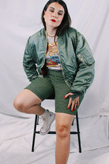 Men's or women's army zip up bomber jacket with long sleeves. Army green color with orange satin liner. Reversible.