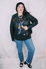 Men's or women's vintage 1970's Harley-Davidson label long sleeve black leather motorcycle jacket with silver hardware and patches.