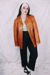 Men's or women's vintage 1970's Grodins label long sleeve tan light brown buttery leather jacket with button closure. Western style.