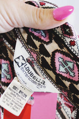 Women's vintage 1970's Loubella Extendables Inc. California label long sleeve printed blouse with a half button closure and dagger collar