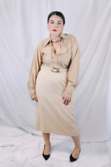 Women's or mens' vintage 1970's long sleeve button up shirt in a slinky nylon tan colored material. White buttons and dagger collar.