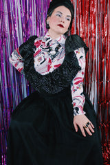 Women's vintage 1980's sleeveless off the shoulder ankle length black colored prom dress. Has a ruffled collar with all over silver metallic polka dots.