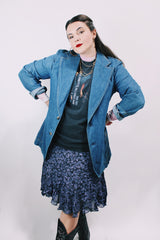 Men's or women's vintage 1970's Lee label long sleeve light wash denim blazer with two button closure, double lapel, and front pockets.