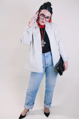 Women's vintage 1990's Worthington label long sleeve bone white leather jacket with a collar, a zipper up the front, and two side pockets.