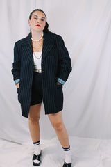 Men's or women's vintage 1970's University Seal Authentic Fashion label long sleeve navy blue wool blazer with all over pin stripes. Has pockets, textured buttons, and a back slit.