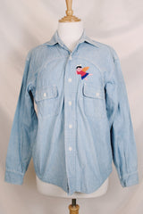 Men's or women's vintage 1970's Lepe, Puerto Vallarta, Mexico label long sleeve light blue denim wash chambray button up shirt with colored embroidery in the front and back.