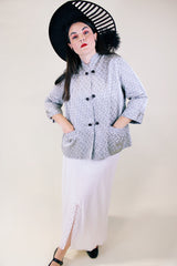 Women's vintage 1960's The Original Stork-A-Lure label long sleeve grey stain jacket with all over print. Black buttons up the front and mandarin collar.