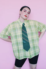Men's or women's vintage 1960's Cortland short sleeve button up collared shirt with two chest pockets in a green and yellow plaid print.
