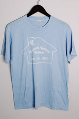 Women's or men's vintage 1970's Screen Stars, Made in USA label short sleeve light blue tee with a white graphic on the front in a polyester and cotton material.