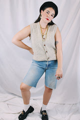 Men's or women's vintage 1970's Jantzen, Made in USA label sleeveless button up sweater vest cardigan in a wool and acrylic material. Oatmeal color with navy speckles and a cable knit texture.