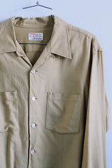 Men's vintage 1950's Viyella, Manhattan label long sleeve button up shirt with collar and two chest pockets in a tan mustard yellow color.
