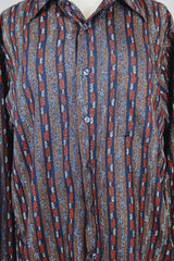 Men's or women's vintage 1970's Montgomery Ward, JCPenney label long sleeve button up shirt in lightweight polyester material. Black with tan and orange vertical stripe pattern.